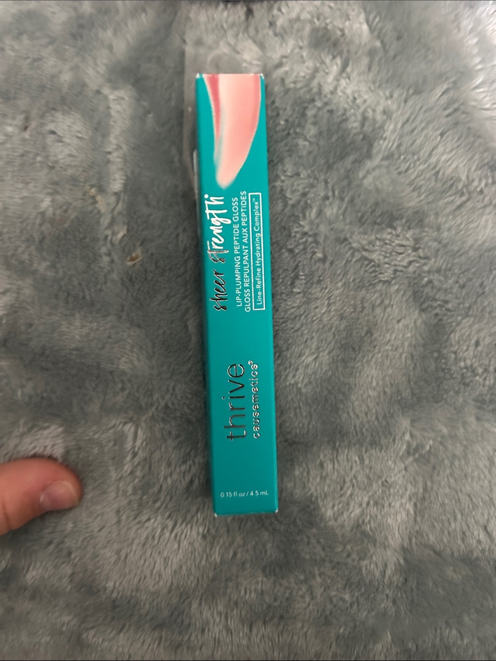 thrive causemetics Sheer Strength Lip Gloss - Teal Packaging with Pink Accent